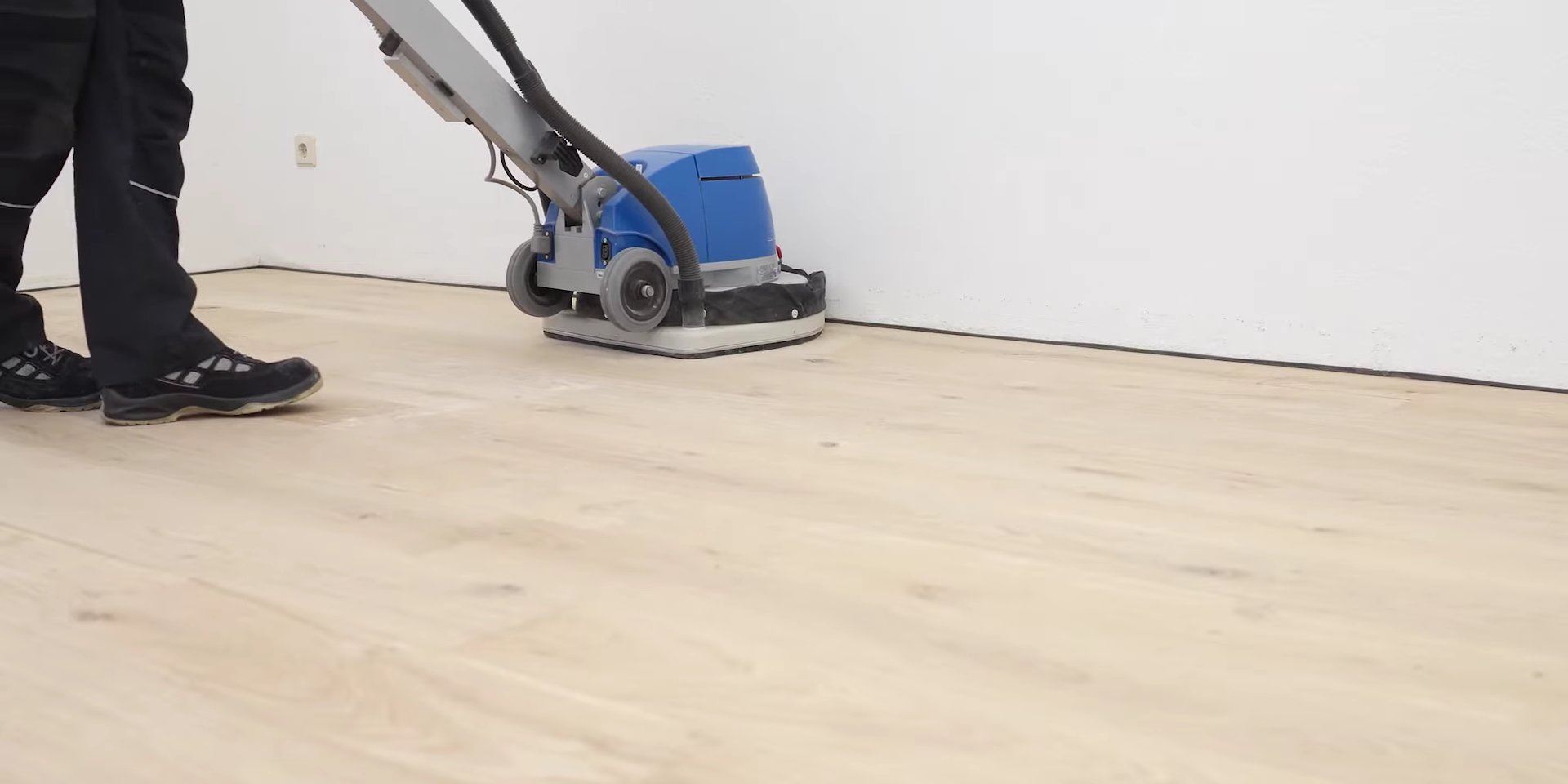 The “Show Home” Clean in Tottenham — European oak engineered floor undergoing dust-free sanding to prepare for an invisible, non-filming finish.
