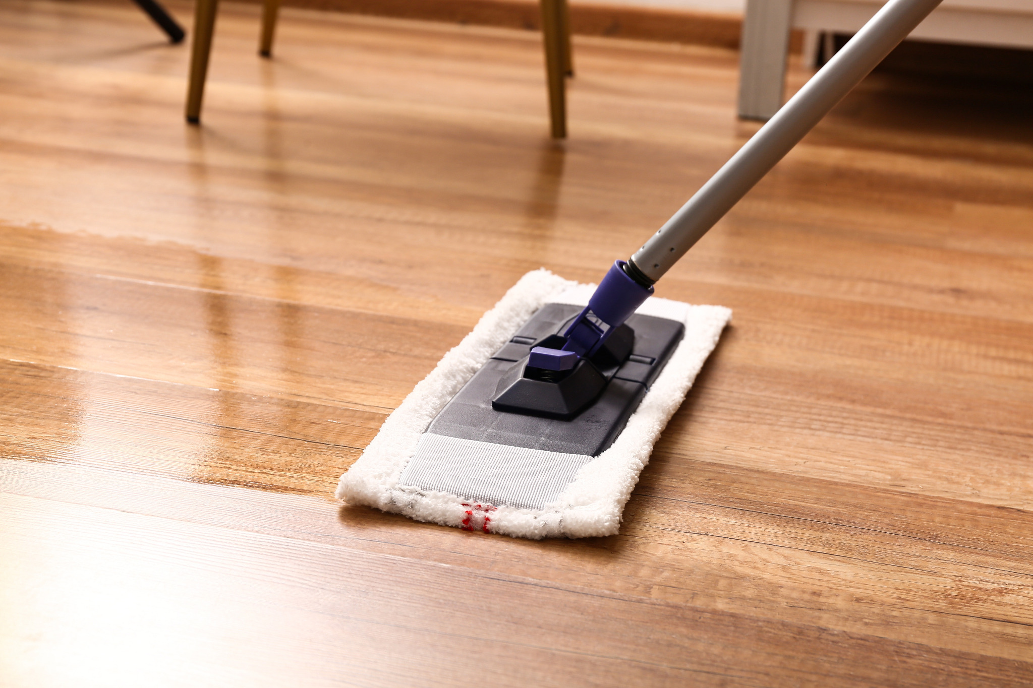The “Show Home” Clean in Tottenham — oak engineered wood floor with ultra-matt finish being wiped with a microfibre flat mop for a streak-free, non-filming result.